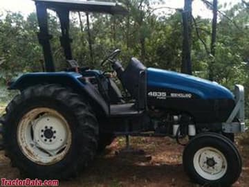 New Holland 4835 with ROPS and two-wheel drive.