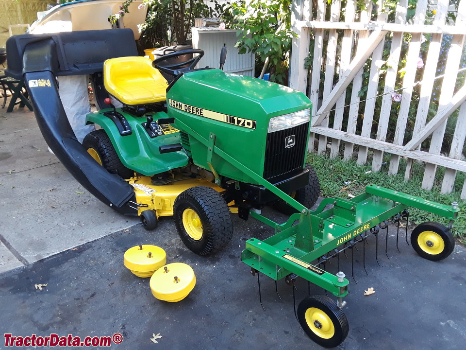 John Deere 170 with bagger, thatcher, and wheel weights.