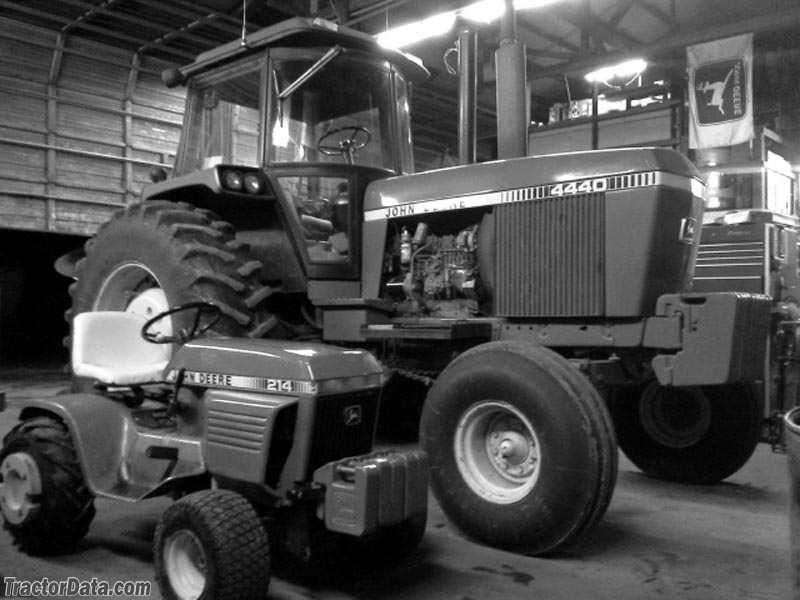 John Deere 214 next to John Deere 4440.