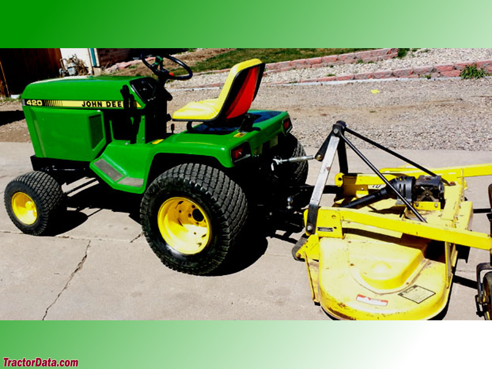 John Deere 420 with rear-mount finish mower.