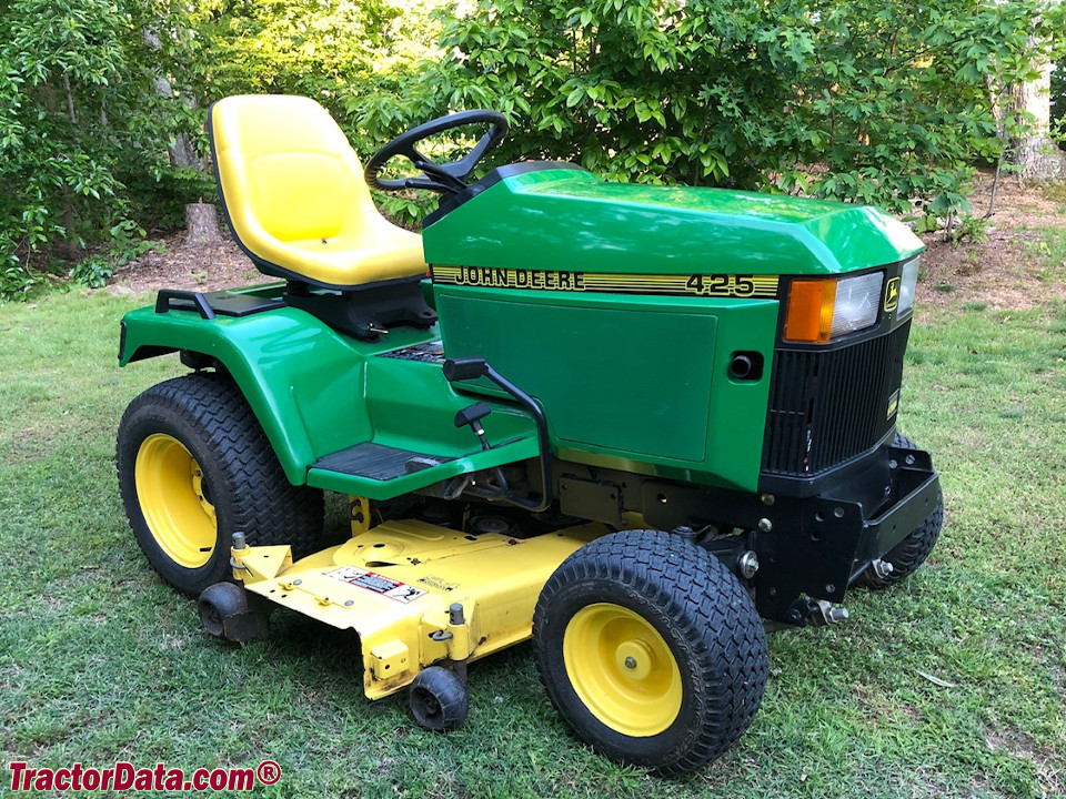 John Deere 425 with mower and three-point hitch.