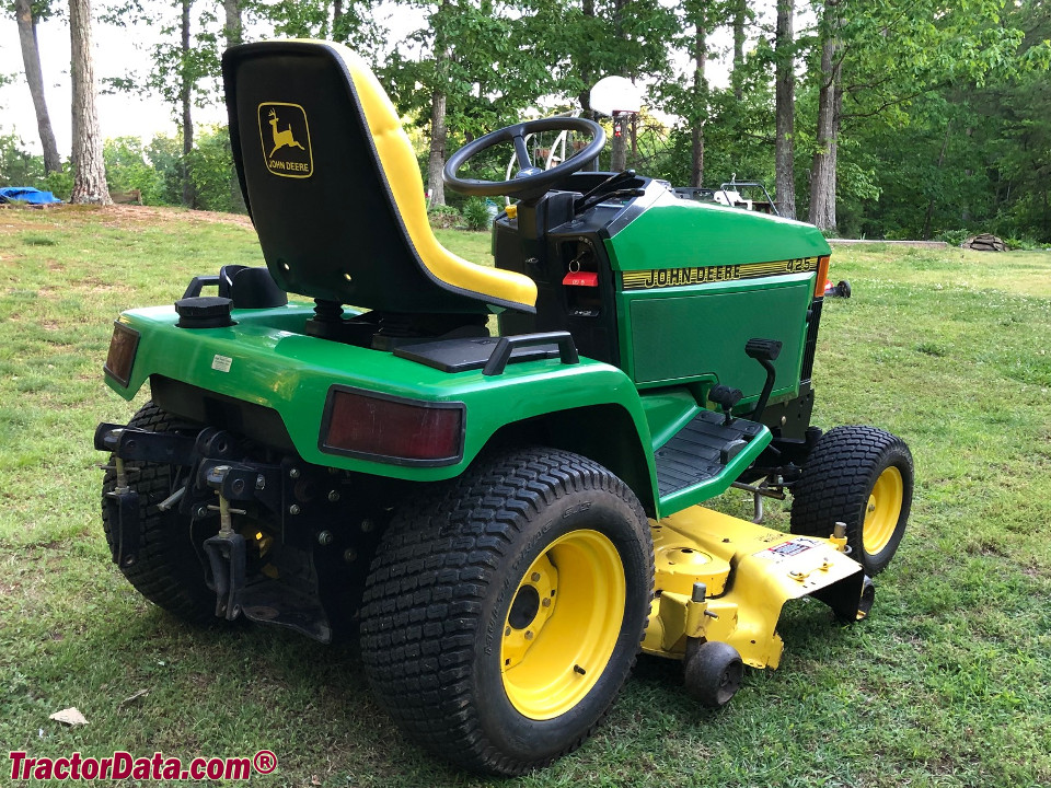 John Deere 425 with mower and three-point hitch.