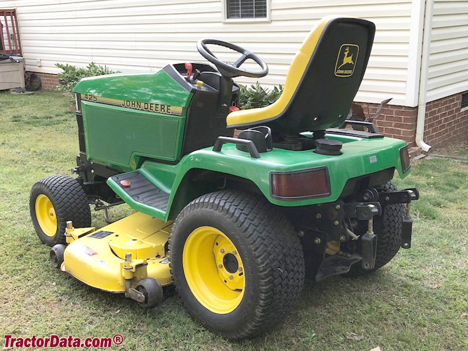 John Deere 425 with mower and three-point hitch.