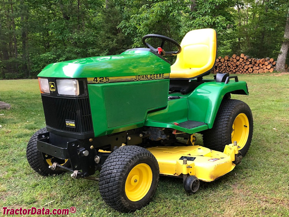 John Deere 425 with mower and three-point hitch.