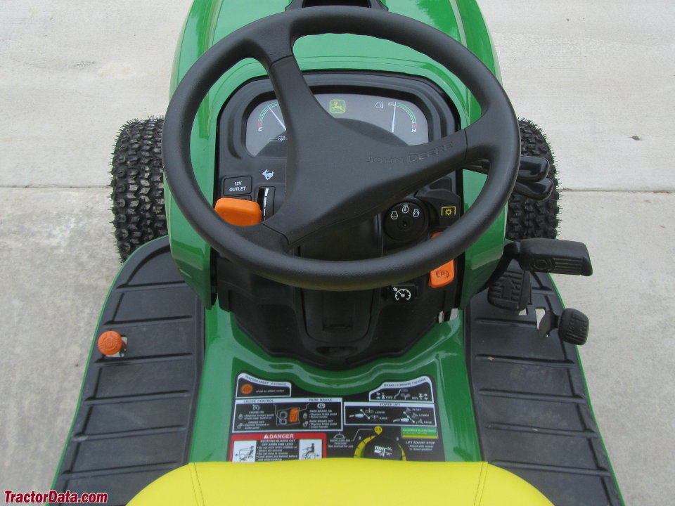 Early-style John Deere X739 operator station and controls.