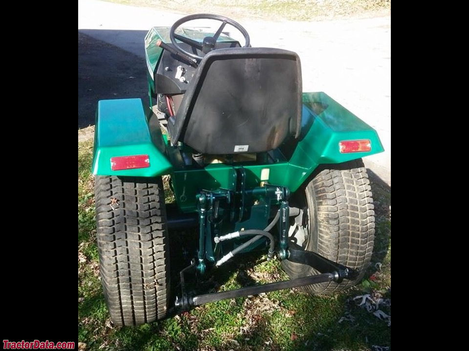Massey Ferguson 320GTX garden tractor with custom paint and headlights.